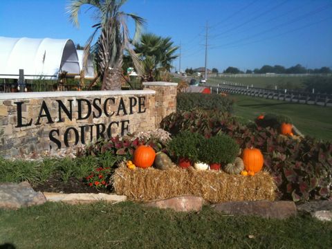 Landscape Source sign decorated for fall